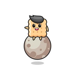 illustration of cracker cartoon sitting on the moon