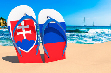 Flip flops with Slovak flag on the beach. Slovakia resorts, vacation, tours, travel packages concept. 3D rendering