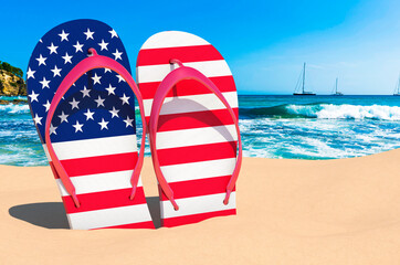 Flip flops with The United States flag on the beach. the USA resorts, vacation, tours, travel packages concept. 3D rendering