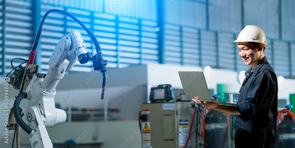 Poster engineer working with industrial 4.0 technology in factory. with robot arm machine. futuristic innov