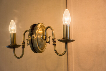 Candle lanterns attached to the glass wall