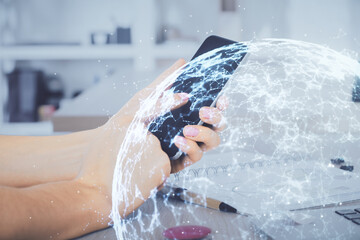 Double exposure of man's hands holding and using a phone and social network theme drawing.