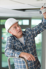 cctv technician positioning the device