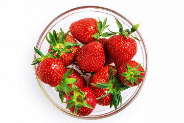 Strawberries in a glass transparent bowl
