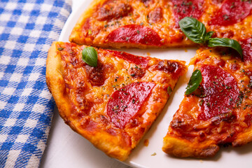 Pizza with salami. Traditional italian recipe.