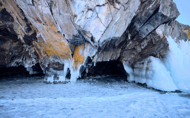 Ice and grotto in coastal rocks, on Lake Baikal, Irkutsk region, Russia