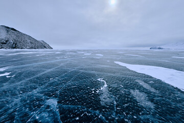 Landscape with transparent ice of Lake Baikal, Irkutsk region, Russia