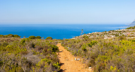 Dirt Track hiking paths on top of a mountain by the coast
