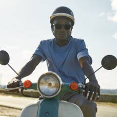 Portrait of african american man in helmet on scooter