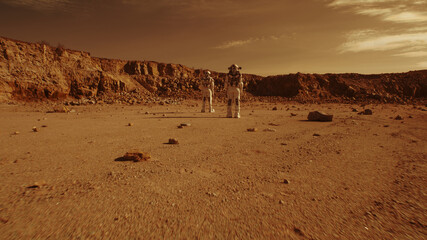 Unrecognizable astronauts walking on Mars © Framestock