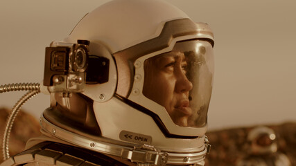 Female cosmonaut recording video during expedition on Mars