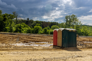 Portable restroom on the new road construction