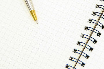 Close-up notebook or note book diary with a pen or pencil on top view desk or boardroom table for meeting notes.