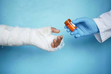 doctor recommend medicine for injured painful hand with bandage 