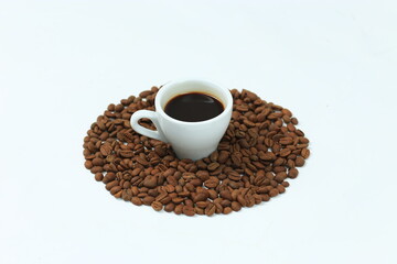 Coffee cup and beans on a white background.