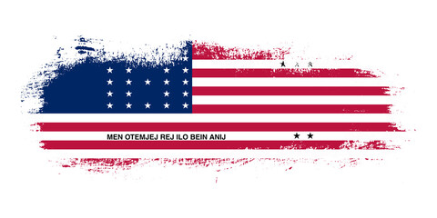 Stain brush stroke flag of Bikini Atoll country with abstract banner concept background