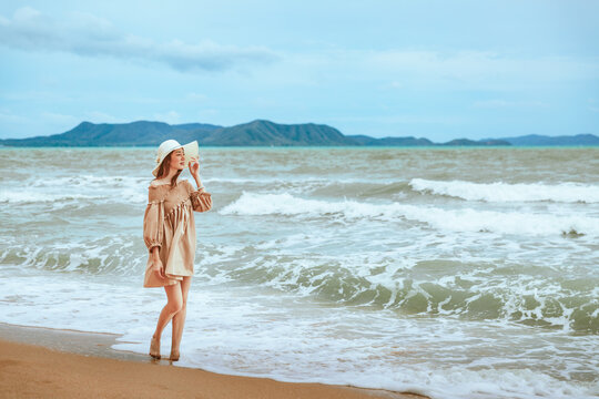 Traveler asian woman travel on beach in summer Thailand