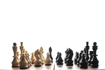 Wood chess pieces on a board isolated white background