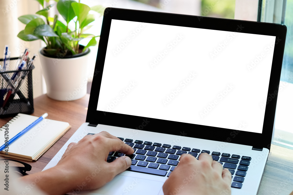 Poster mockup copy space computer notebook laptop concept , a man\'s hand using a laptop on internet websit