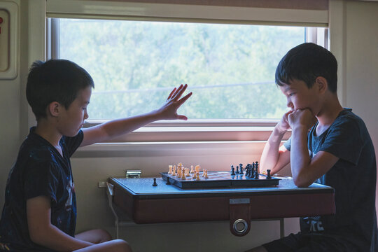 Young boys playing chess