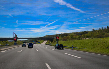 Three lanes motorway with temporary speed limit sign (highway A8 near Leonberg, Germany)