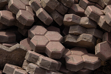 Dismantled old paving slabs piled in a pile.