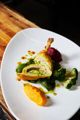 Kiev cutlet on a plate on the background of the kitchen