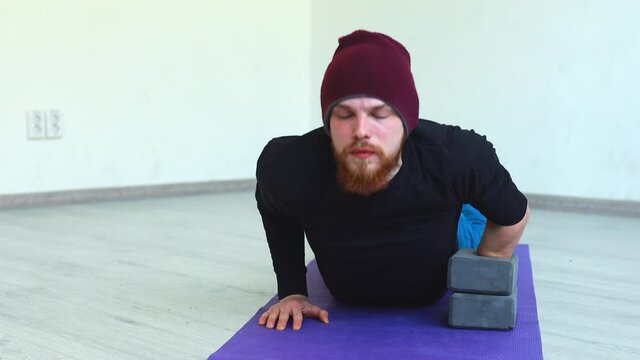 close up amputee hands of young man indoors doing warm up in gym.