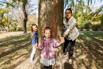 Happy family enjoying sunny autumn day in the park