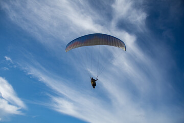 Paragliding over sea with beautiful blue sky background at Phuket,Thailand. soft socus.