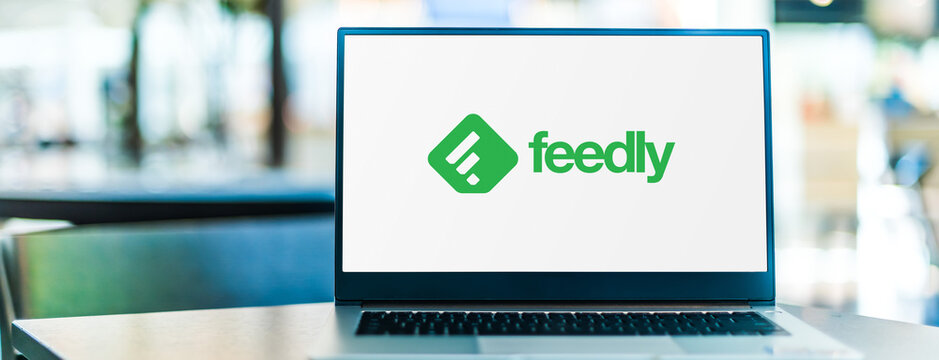 Laptop computer displaying logo of Feedly