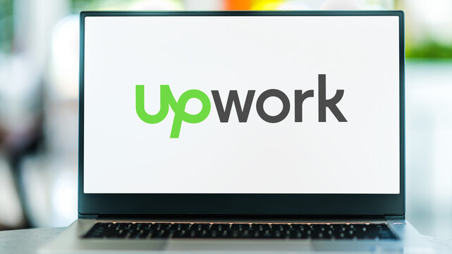 Laptop computer displaying logo of Upwork