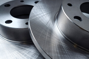 Shiny car disc brakes close-up.