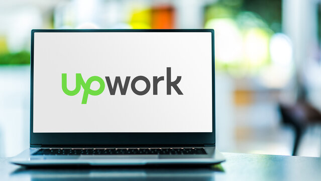 Laptop computer displaying logo of Upwork