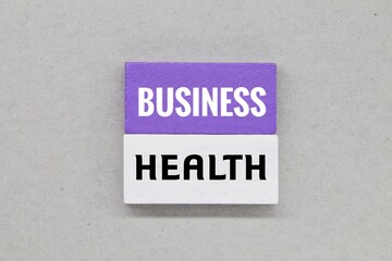 colored wooden cubes with the words Business Health