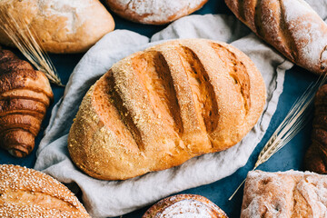 Different types of fresh bread and bakery on the table.
