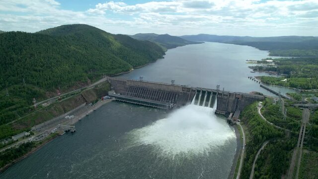water discharge waterfall at the hydroelectric dam , Siberia, Krasnoyarsk, Russia. siberian nature, renewable energy reservoir