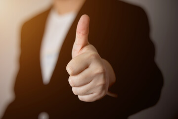 Closeup of businessman showing thumbs up , good job , Approval or support concept
