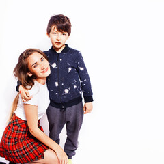 lifestyle and people concept, little cute boy with teenage girl posing together cheerful happy smiling isolated on white background