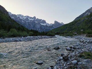 wild river with crystal clear water in theth albanian alps in spring