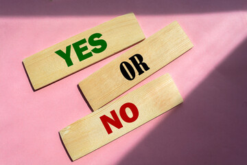 Words YES or No on wooden blocks. Choice business , personal or education concept.