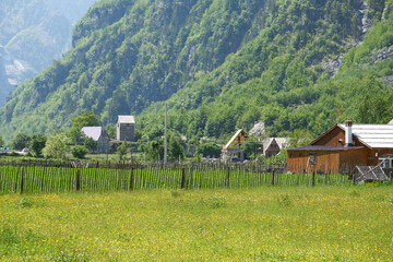 Mountain landscape with houses and farms in Theth in the Albanian alps