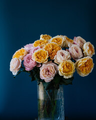 bouquet rose peonies blue background