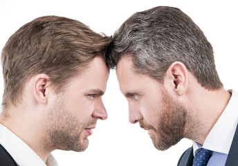 two businessmen starring to each other in business conflict, disagreement