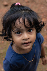 closeup of a cute little girl with a curious look on her face