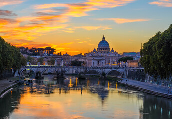 Sunset view of Basilica St Peter, bridge Sant Angelo and river Tiber in Rome. Italy. Architecture and landmark of Rome. Postcard of Rome