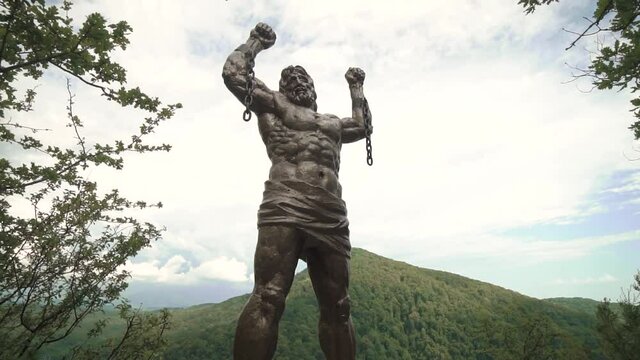 A huge sculpture of Prometheus on a rock filmed in motion on a stabilizer Sochi