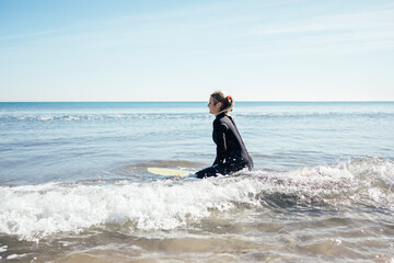 Girl surfer on the beach