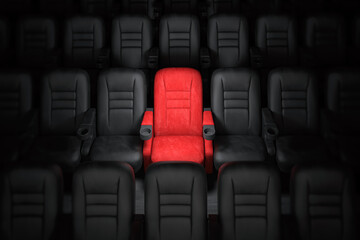Fototapeta premium One red empty seat among others black seats in cinema hall.