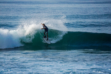 Surfer on perfect blue aquamarine wave, empty line up, perfect for surfing, clean water, Indian Ocean close to Mirissa